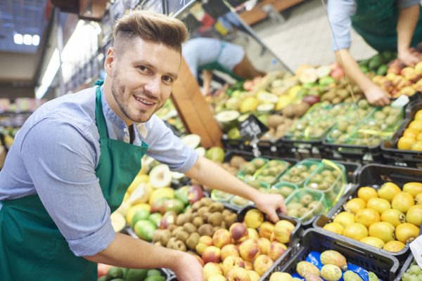 Man working hard in supermarket